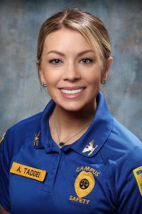 Allison Hoesch posing for a formal headshot in a blue Widener University campus safety uniform.
